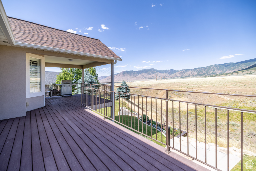 Wooden deck featuring a mountain view