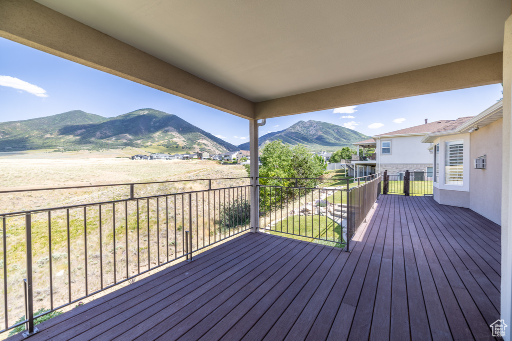 Wooden terrace featuring a mountain view