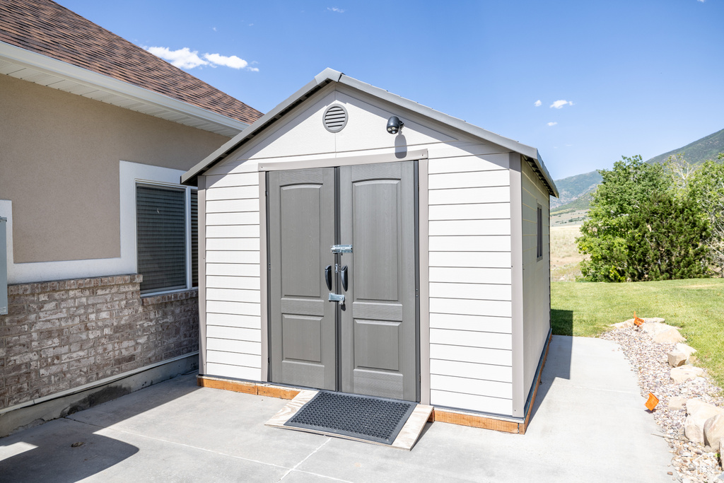 View of shed with a mountain view