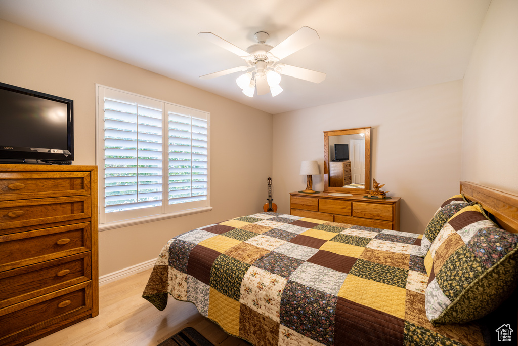 Bedroom featuring light wood finished floors and ceiling fan