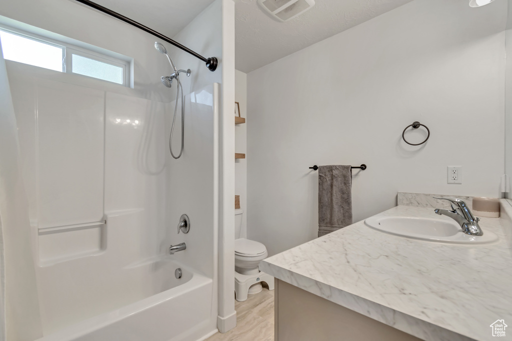 Full bath featuring vanity and shower / bath combination