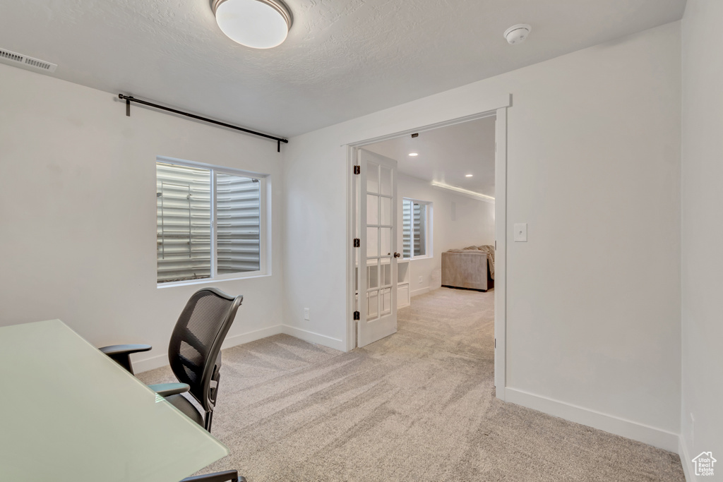 Office featuring carpet floors and french doors