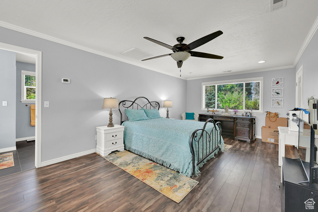 Bedroom with multiple windows, dark wood-style floors, ornamental molding, a ceiling fan, and recessed lighting