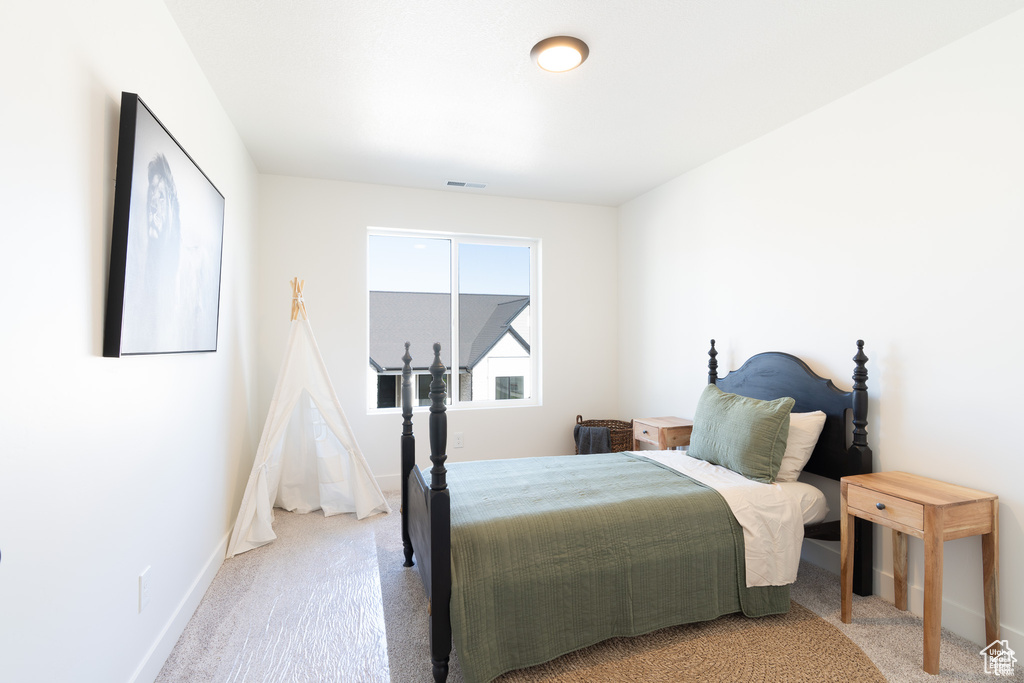 Carpeted bedroom with baseboards