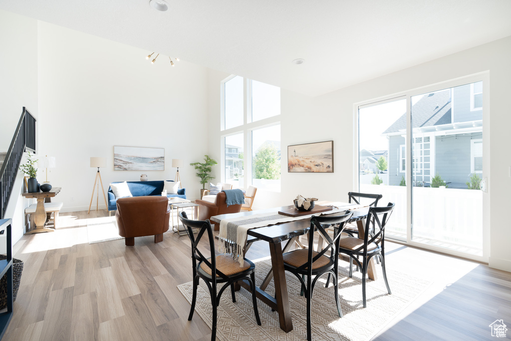 Dining room featuring light wood finished floors and a chandelier