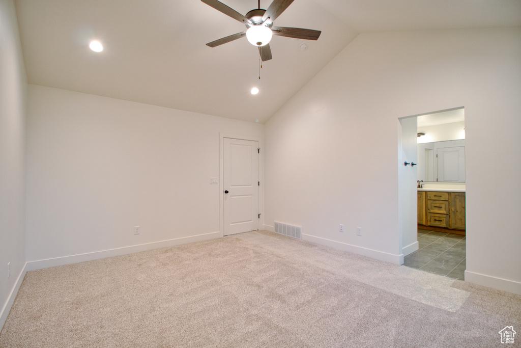 Spare room with a ceiling fan, light carpet, high vaulted ceiling, and recessed lighting
