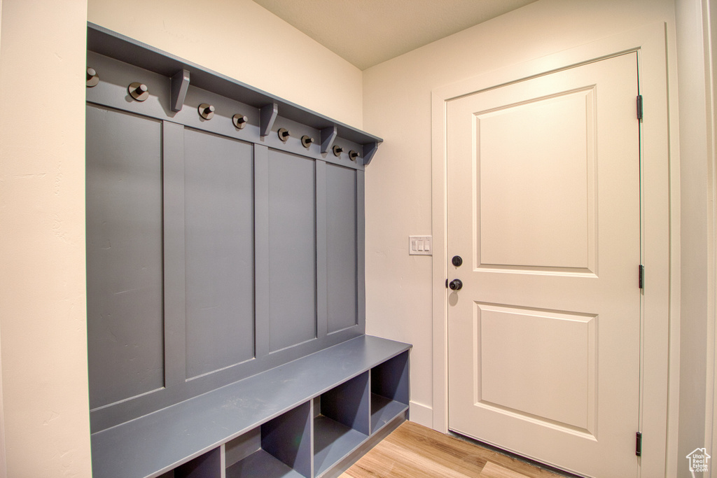 Mudroom with light wood-style flooring
