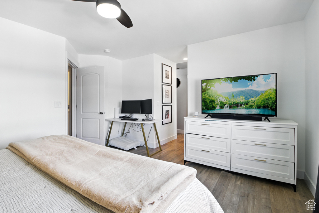 Bedroom with dark wood-style floors and a ceiling fan