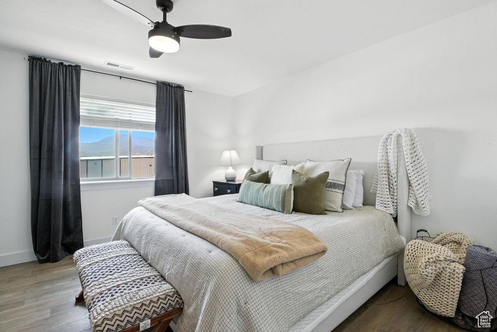 Bedroom featuring wood finished floors and ceiling fan