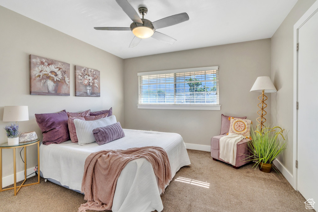 Bedroom with carpet and ceiling fan
