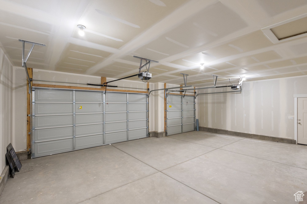Garage featuring a garage door opener