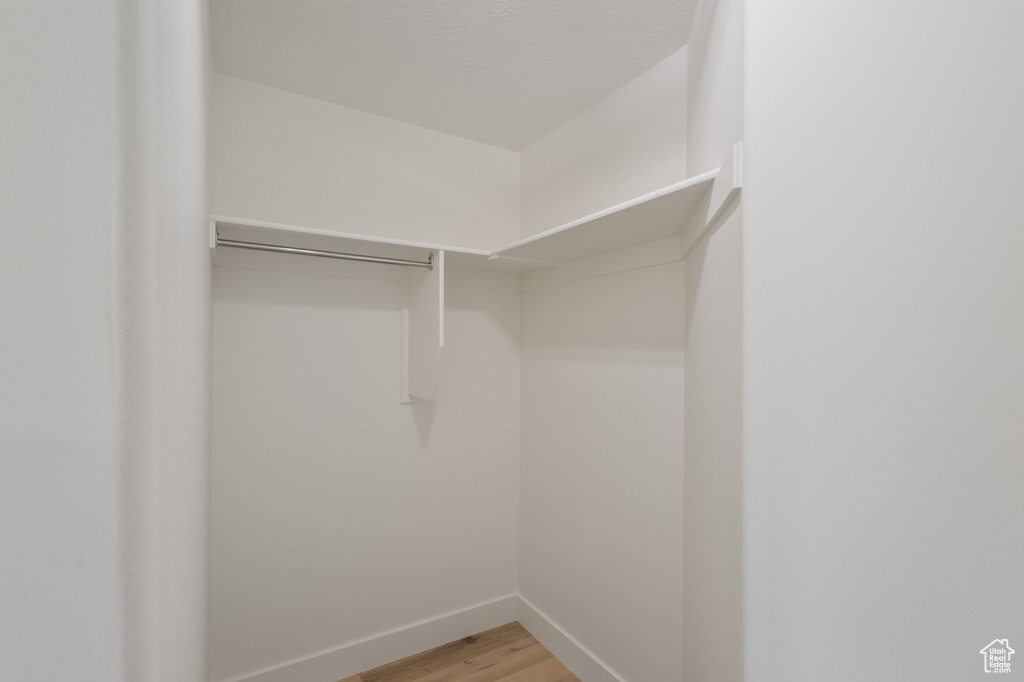 Walk in closet featuring light wood finished floors