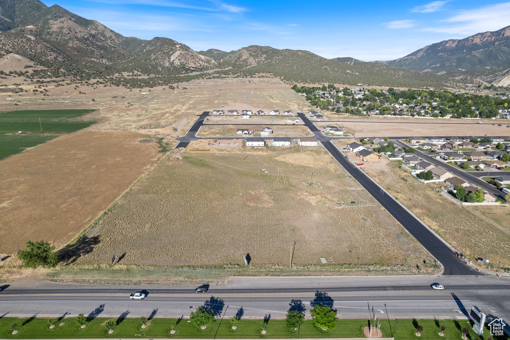 Aerial view of property\'s location with a mountainous background