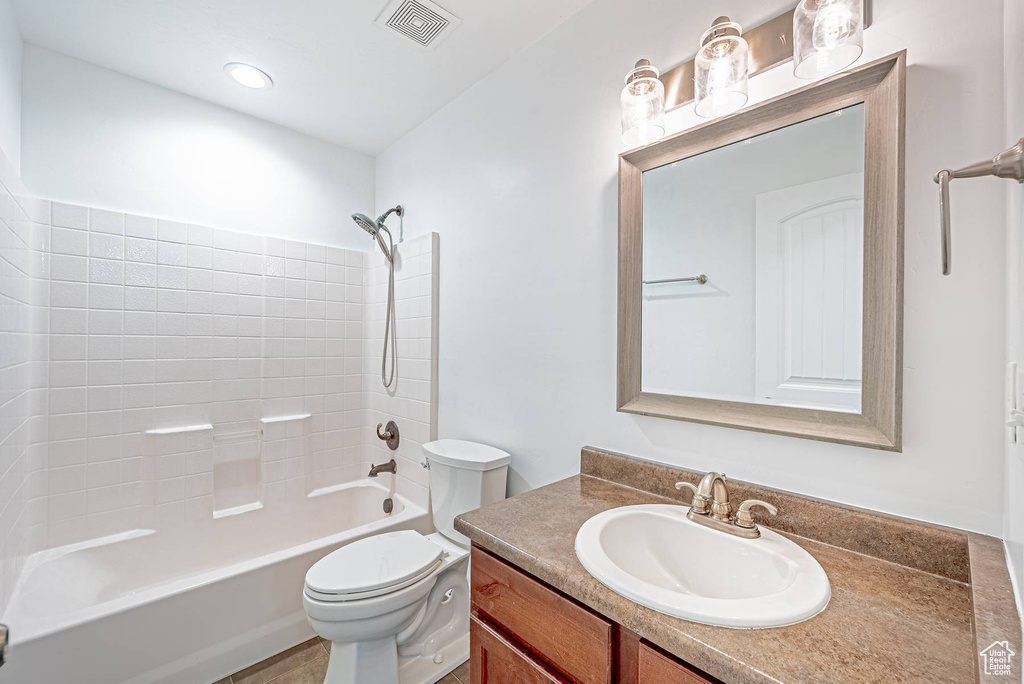 Bathroom featuring vanity and shower / washtub combination