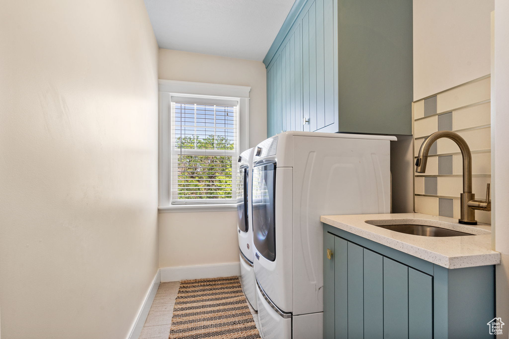 Washroom with washer and dryer and cabinet space