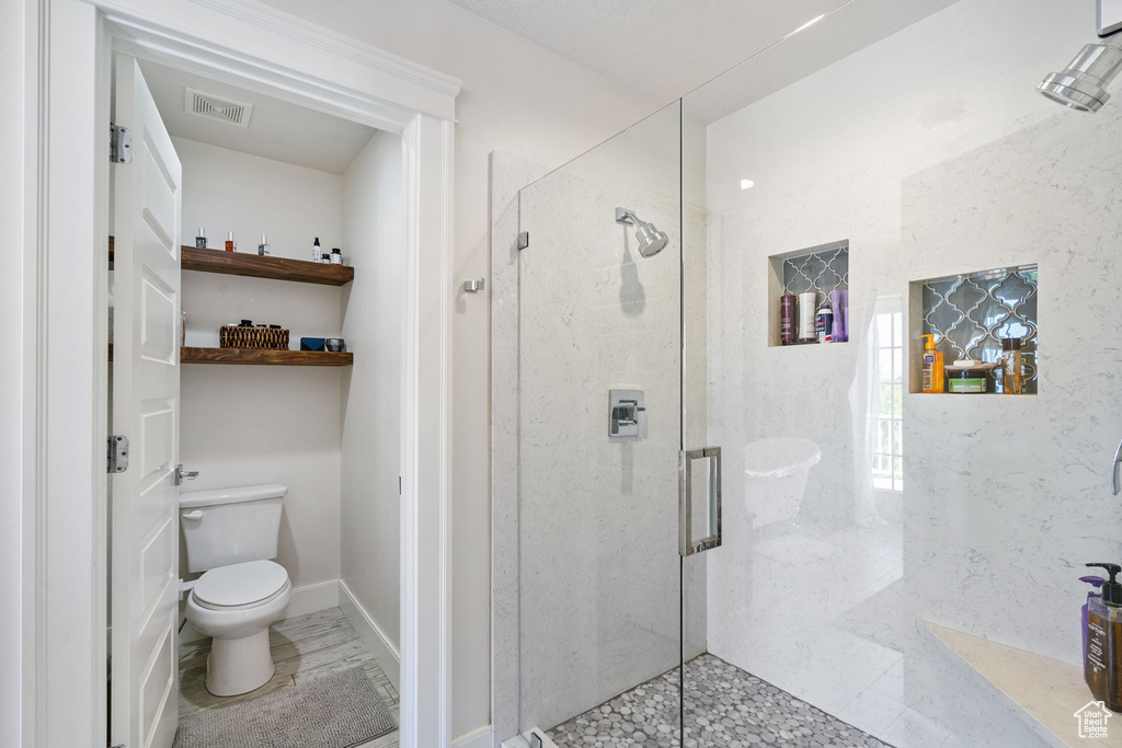 Full bath with a shower stall
