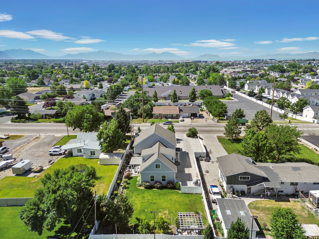 Aerial view of residential area featuring mountains