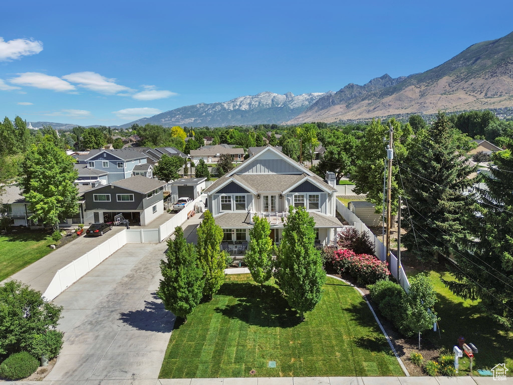 Aerial perspective of suburban area with a mountain backdrop