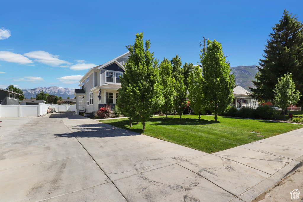 View of front of property featuring driveway and a mountain view