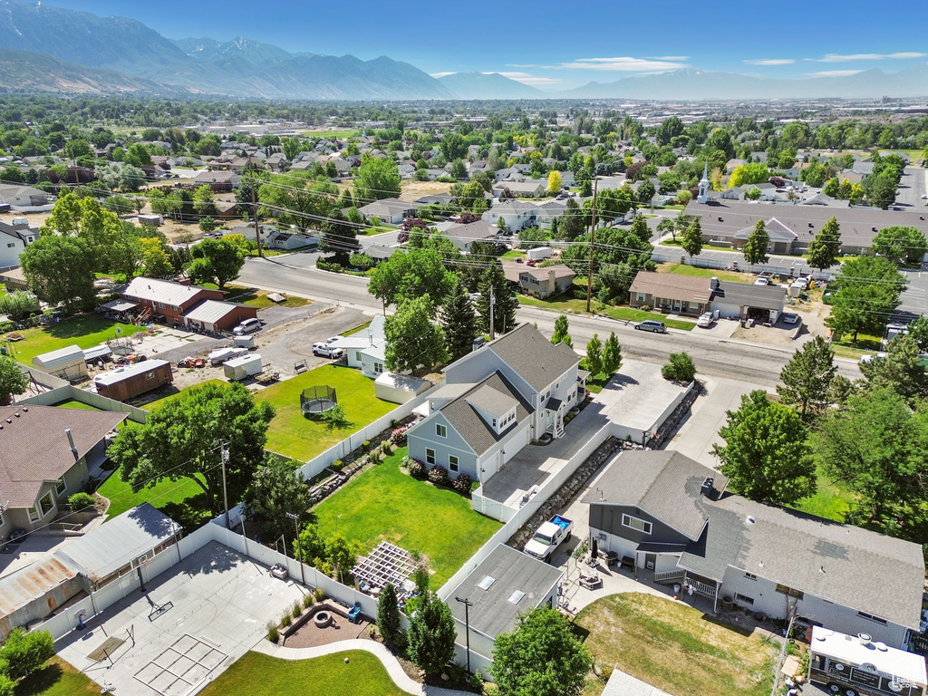 Aerial perspective of suburban area featuring a mountainous background