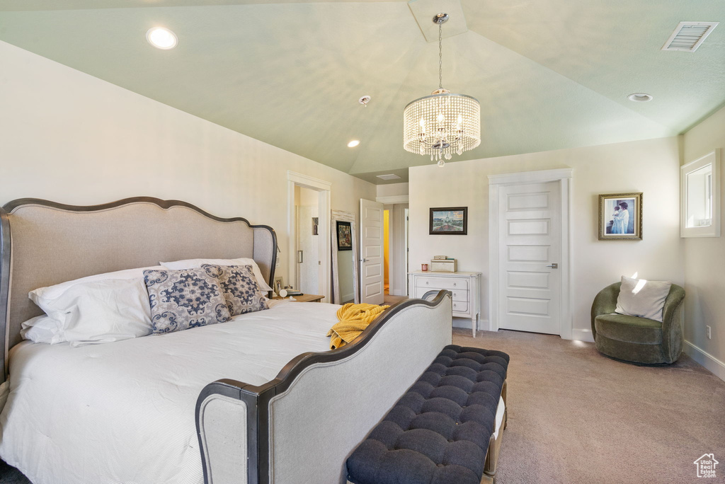 Carpeted bedroom with a chandelier and recessed lighting