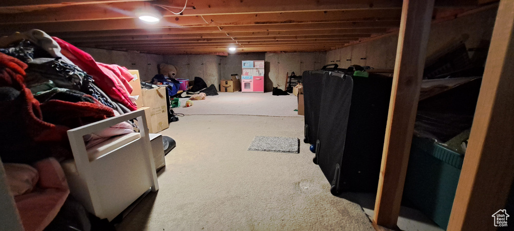 Unfinished below grade area featuring carpet flooring