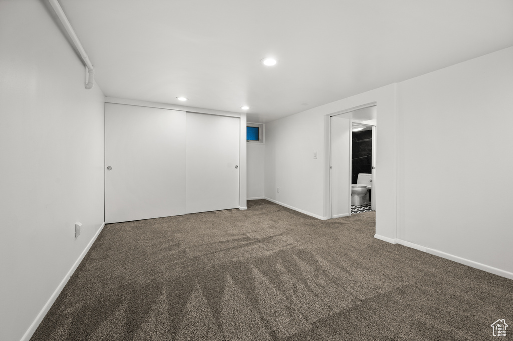 Empty room featuring recessed lighting and carpet flooring