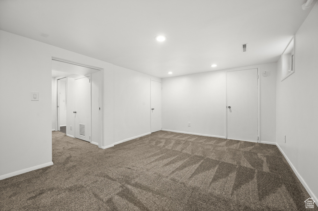 Finished below grade area featuring carpet floors and recessed lighting