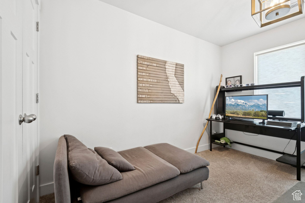 Living area with carpet floors and baseboards
