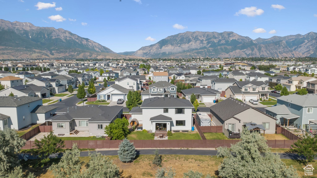 Aerial perspective of suburban area with a mountain backdrop