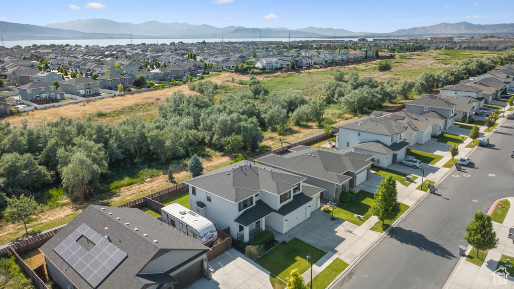 Aerial view of residential area featuring a mountainous background