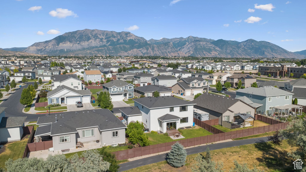 Aerial perspective of suburban area featuring a mountain backdrop