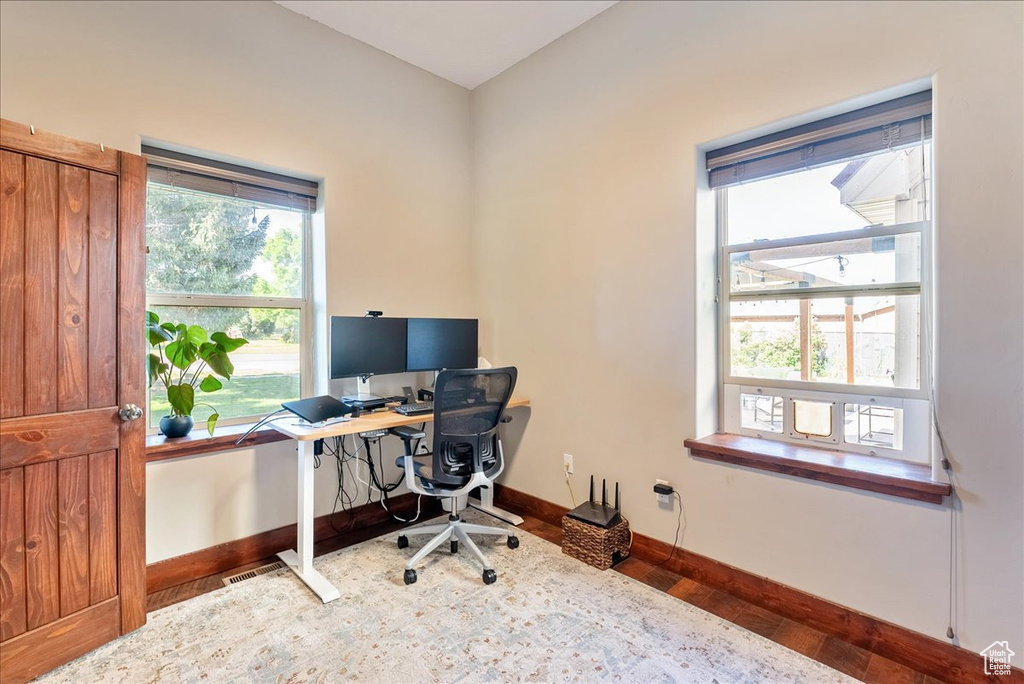 Home office with wood finished floors