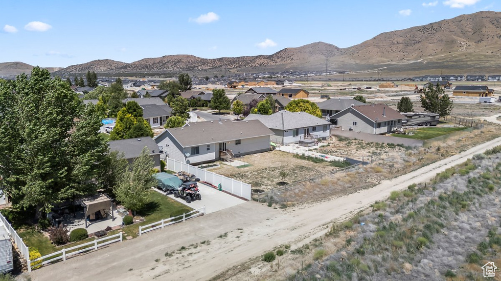 Aerial perspective of suburban area featuring a mountain backdrop
