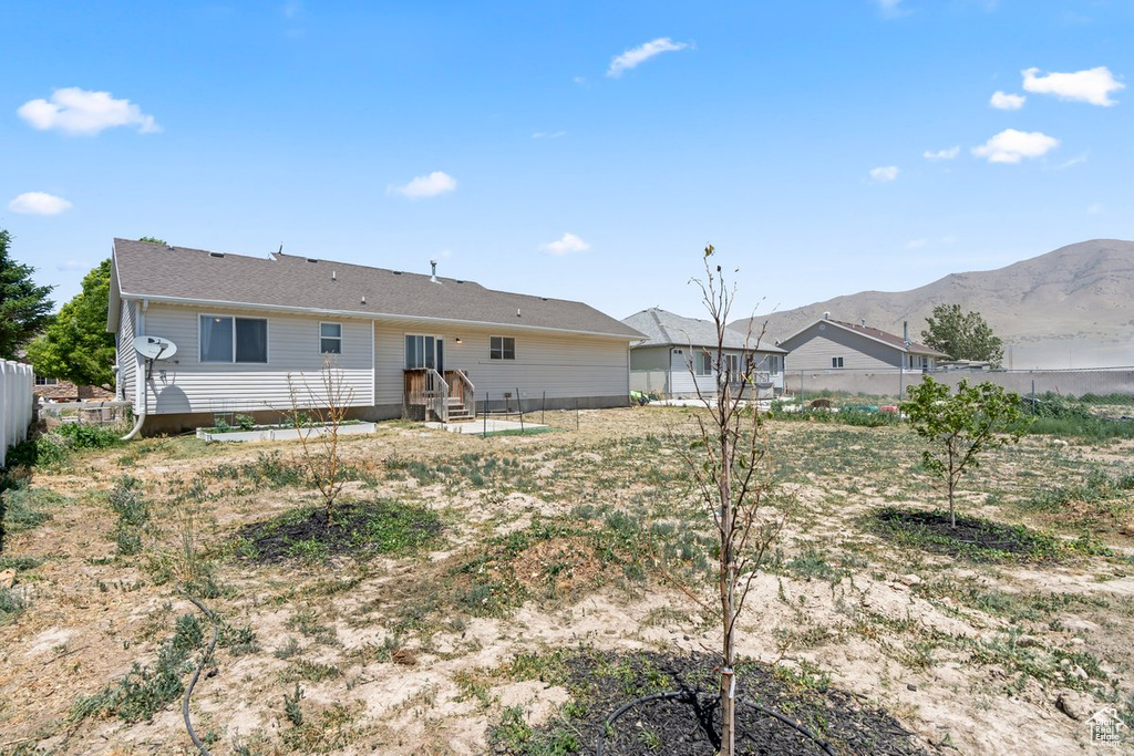 Rear view of house with a mountain view