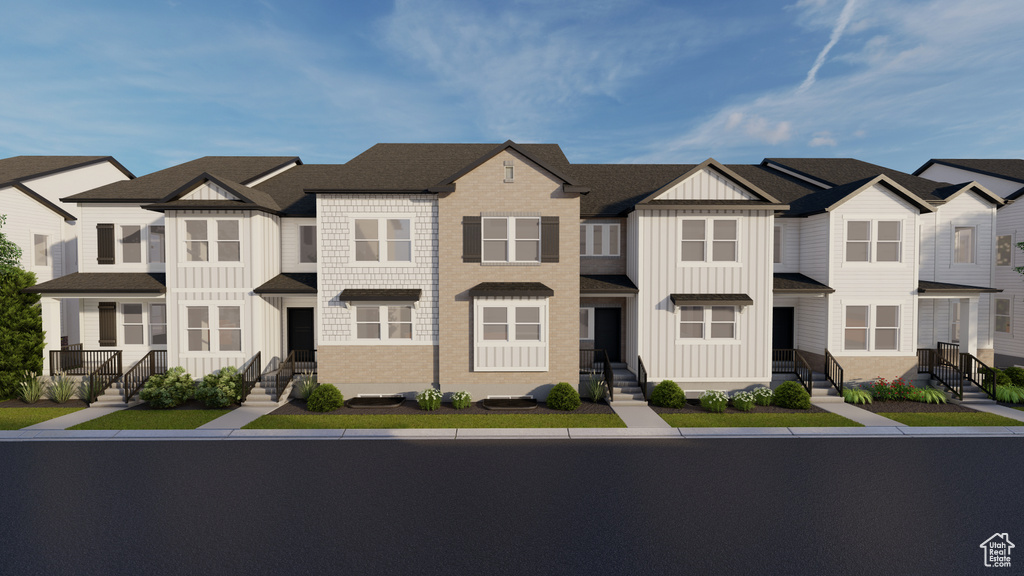 Multi unit property with board and batten siding, entry steps, and a residential view