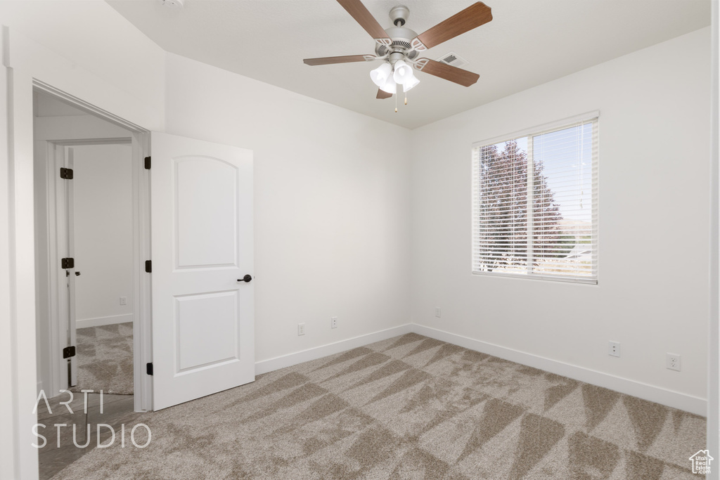 Unfurnished bedroom with carpet floors and a ceiling fan