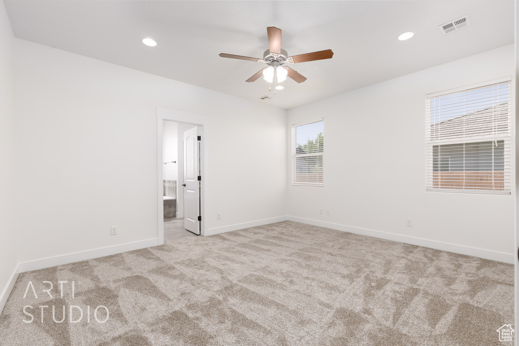 Empty room with carpet floors, a ceiling fan, and recessed lighting