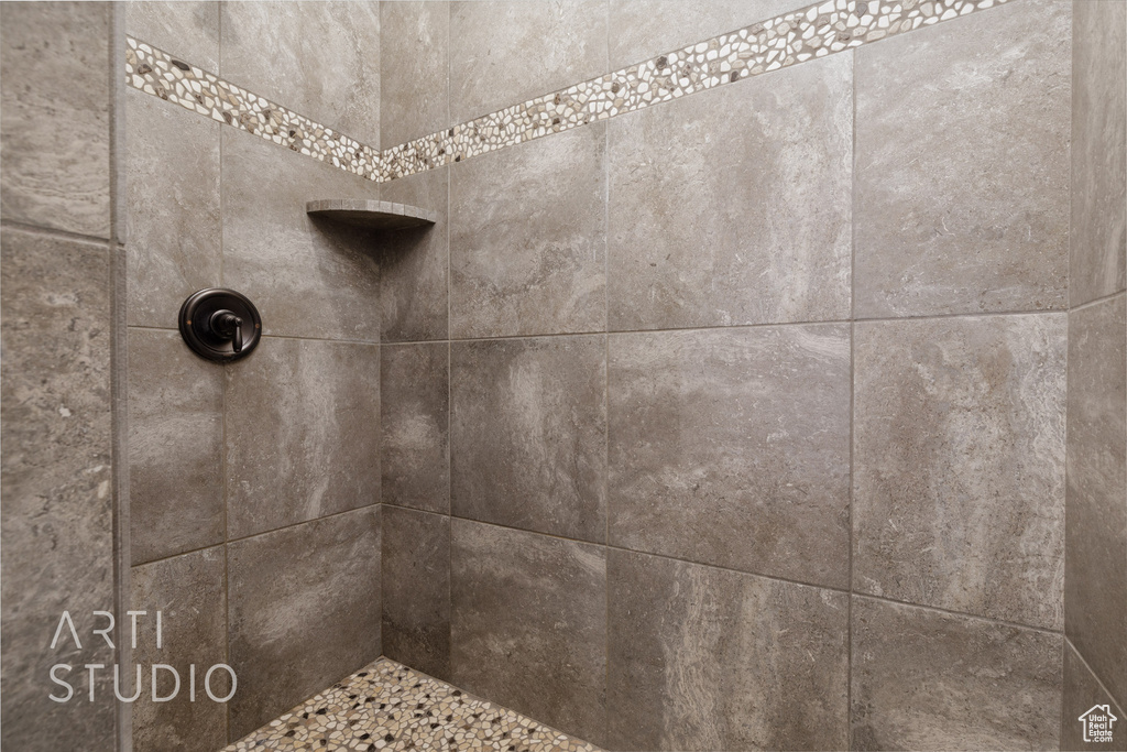 Bathroom view of a tile shower