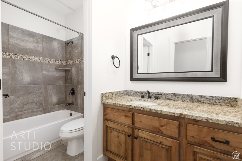 Full bathroom with vanity, bathtub / shower combination, and tile patterned flooring