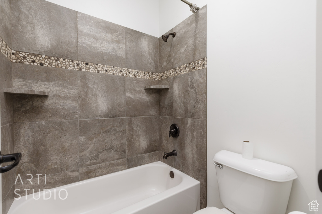 Full bath featuring toilet and tub / shower combination