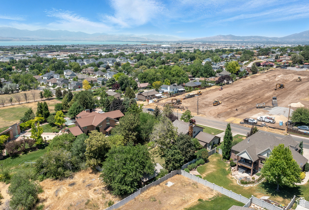 Aerial perspective of suburban area with a mountainous background