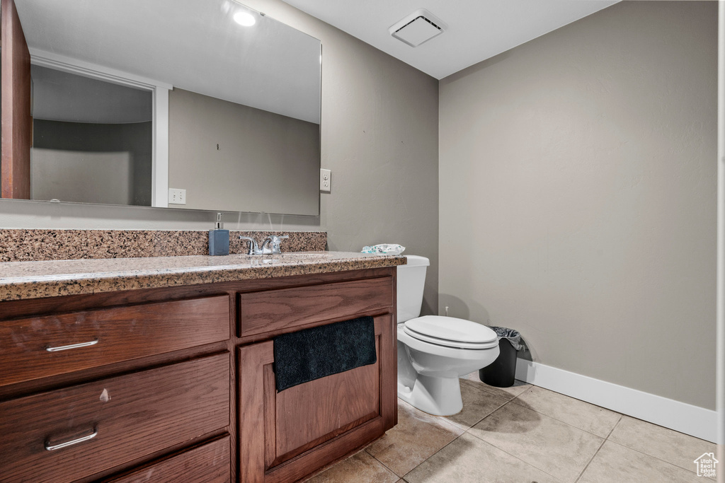 Bathroom featuring vanity and tile patterned flooring