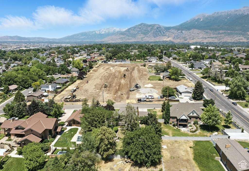 Aerial perspective of suburban area featuring a mountain backdrop