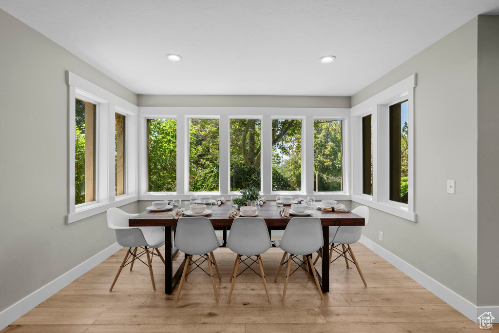 Dining area featuring healthy amount of natural light, recessed lighting, and light wood-type flooring
