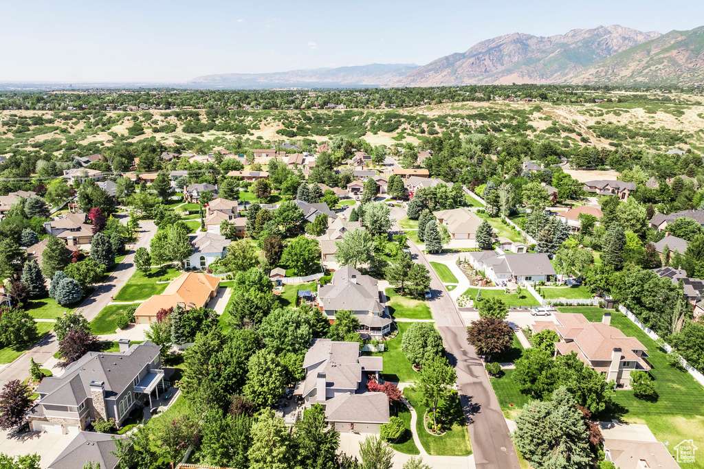 Aerial perspective of suburban area featuring a mountainous background