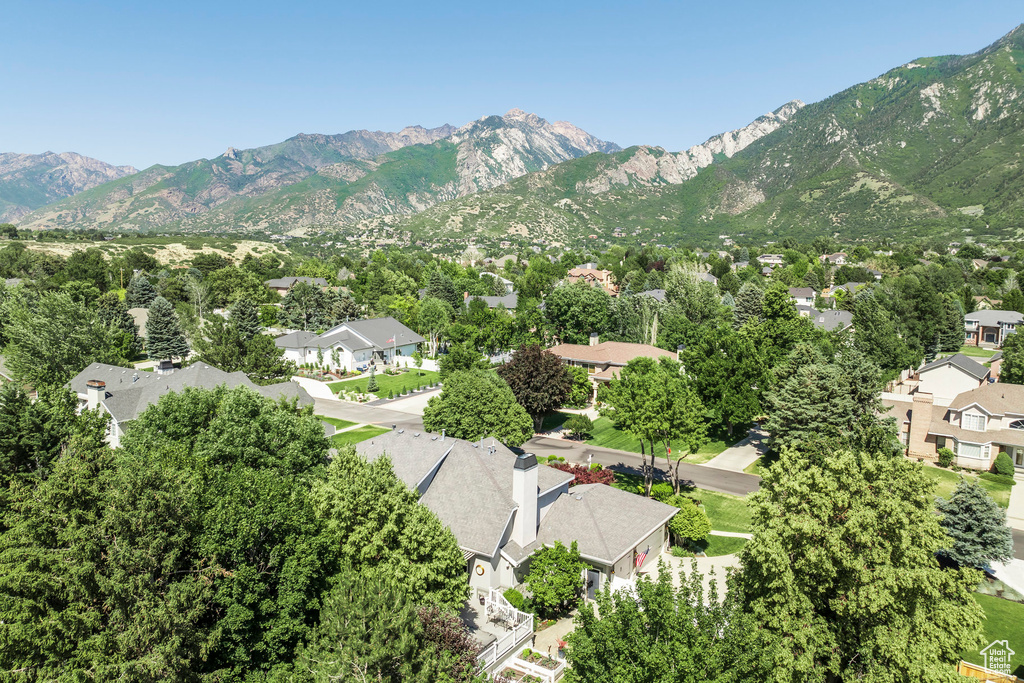 Aerial perspective of suburban area with a mountain backdrop