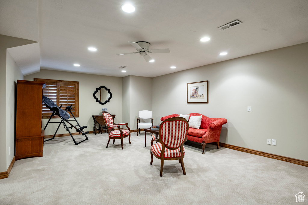 Living area with light colored carpet, recessed lighting, and ceiling fan