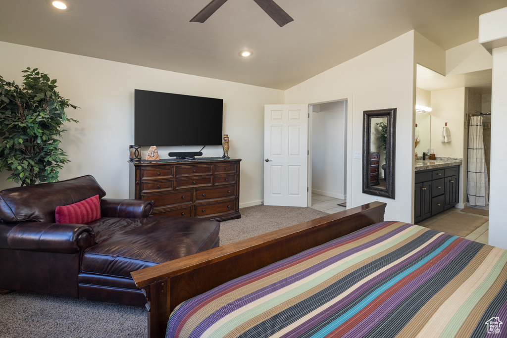 Bedroom featuring light carpet, ensuite bathroom, recessed lighting, lofted ceiling, and a ceiling fan