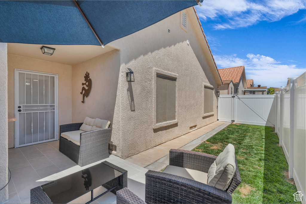View of patio / terrace with a gate and outdoor lounge area